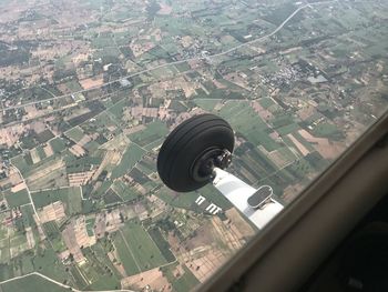 Aerial view of city seen through glass window