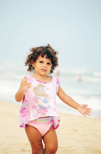 Cute girl standing at beach