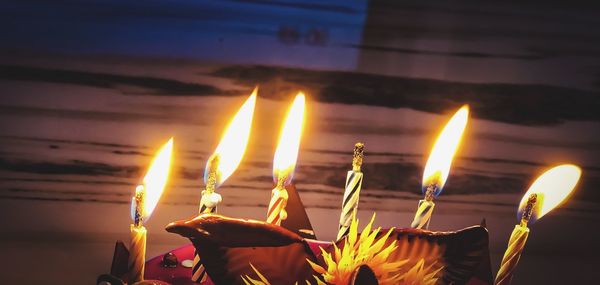 Close-up of burning candles