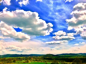 Scenic view of landscape against blue sky