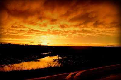 Scenic view of landscape at sunset