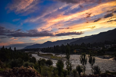 Scenic view of landscape against sky during sunset