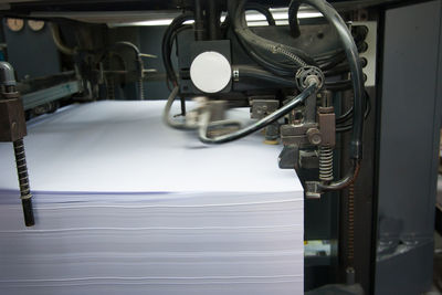 Stack of paper in machinery at factory