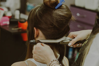 Portrait of a young girl at the hairdresser.