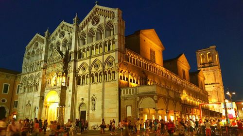 Low angle view of people at night