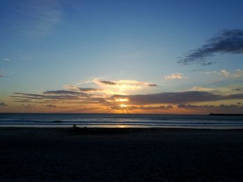 View of beach at sunset