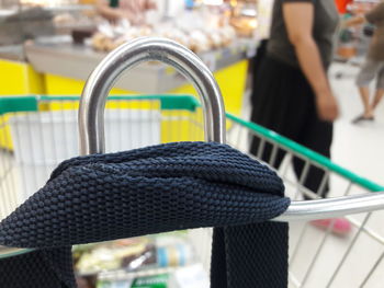 Close-up of woman standing by railing