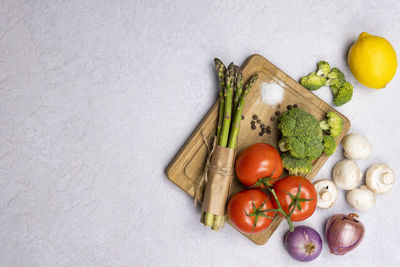 High angle view of fruits and vegetables on white background