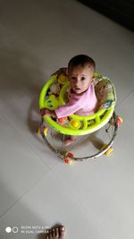 High angle view of cute toy sitting on floor at home