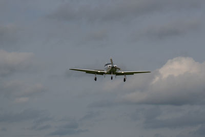 Low angle view of airplane flying in sky