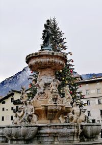 Low angle view of statue against sky