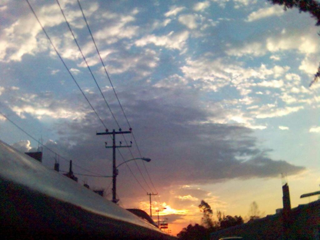 power line, sky, sunset, electricity pylon, cloud - sky, electricity, cable, power supply, connection, beauty in nature, silhouette, scenics, cloud, nature, transportation, cloudy, tranquil scene, tranquility, tree, low angle view