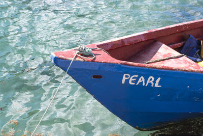 High angle view of text on boat moored at lake