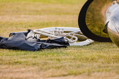 Sousaphone on the grass of the football field at rehearsal