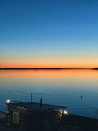 Scenic view of sea against clear sky at sunset