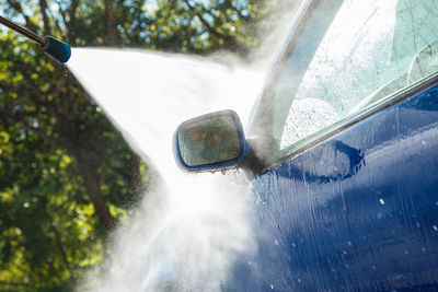 Close-up of raindrops on car windshield