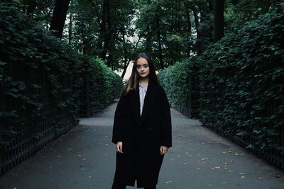 Young woman standing on walkway