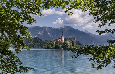 Scenic view of lake and mountains against sky