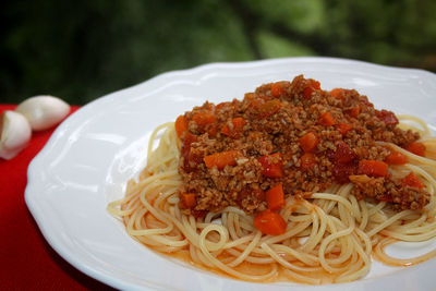 Close-up of pasta served in plate on table