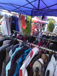 Clothes hanging at market stall