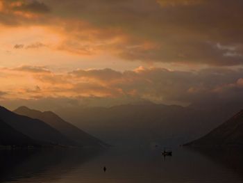 Scenic view of lake against sky during sunset