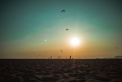 Scenic view of beach at sunset