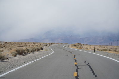 Road amidst landscape against sky