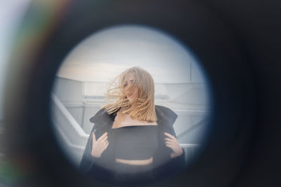 Rear view of woman with umbrella