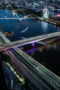 High angle view of light trails on road at night