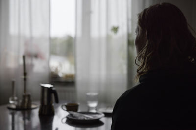 Silhouette of woman looking away