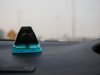 Close-up of blue car on table