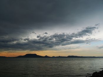 Scenic view of sea against sky at sunset