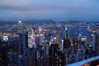 Aerial view of city lit up at night