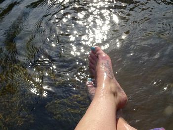 Low section of woman in water