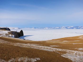 Scenic view of sea against sky during winter