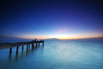 Scenic view of sea against sky at sunset