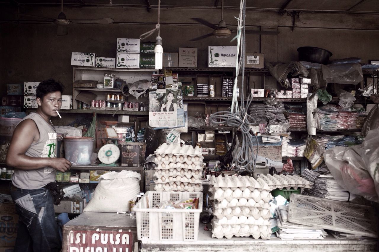 indoors, retail, for sale, working, market, large group of objects, store, abundance, choice, stack, market stall, occupation, display, variation, food and drink, small business, men, shop