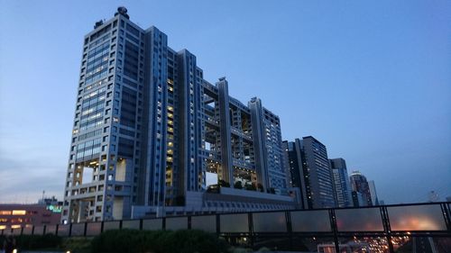 Low angle view of modern buildings against sky