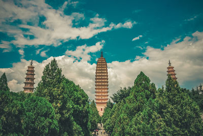 Panoramic view of trees and buildings against sky