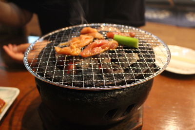 High angle view of meat in cooking pan on table