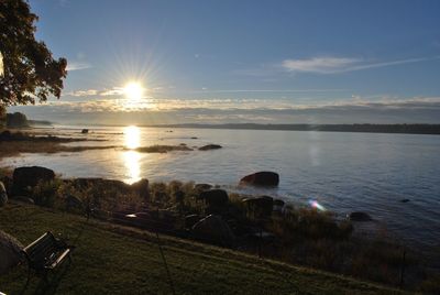 Sun shining over sea