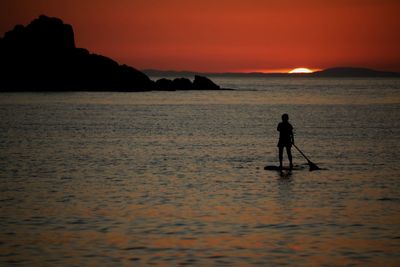Scenic view of sea at sunset