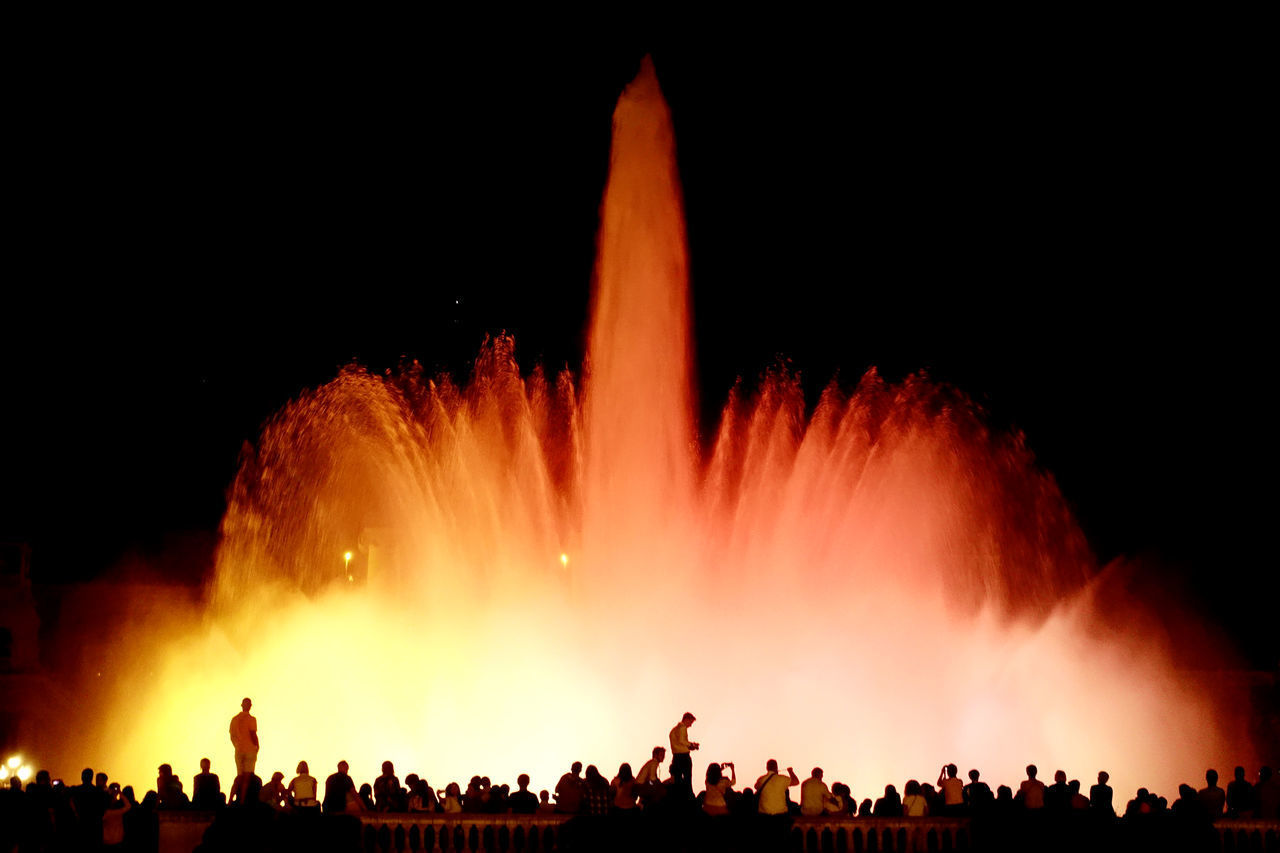 PANORAMIC VIEW OF PEOPLE WATCHING FIREWORK DISPLAY