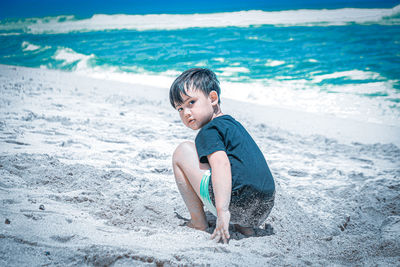 Full length of boy on beach