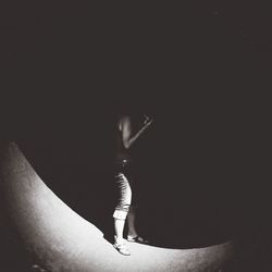 Close-up of woman in dark