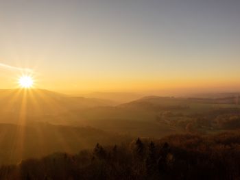 Scenic view of landscape against sky during sunset