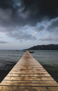 Pier over sea against sky