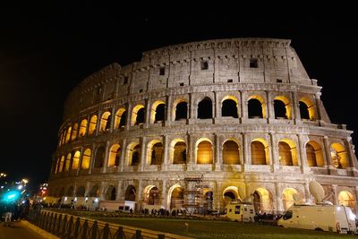 Coliseum against clear sky at night