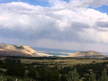 Scenic view of landscape against cloudy sky