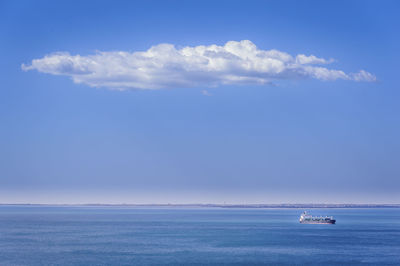 Boats in sea against sky